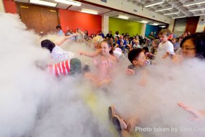 Group of children having fun in a nitrogen cloud
